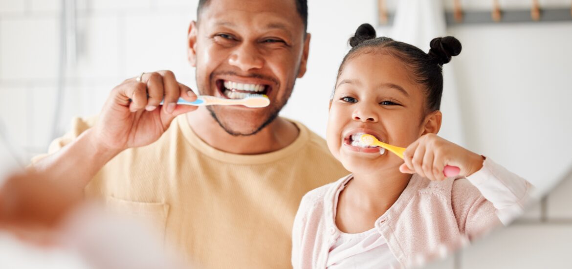 father and daughter brushing their teeth in Jefferson City