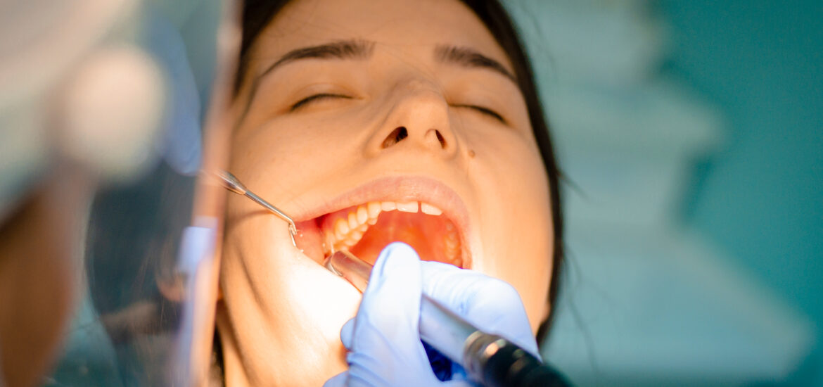 Woman receiving a dental extraction in Jefferson City